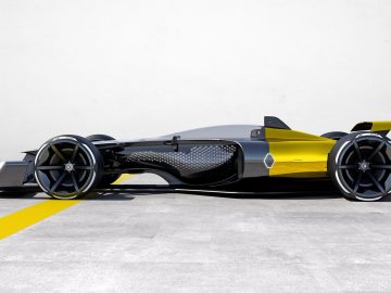 Een geel-zwarte Renault Formule 1-racewagen staat geparkeerd in een kamer.