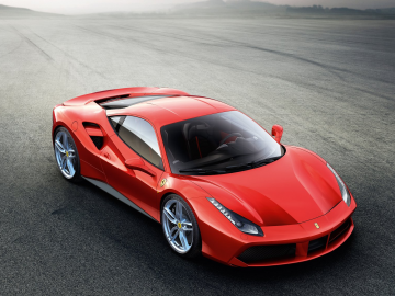 Een Ferrari, winnaar van de Engine of the Year Awards 2017, sportwagen staat geparkeerd op een weg.