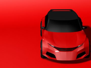 Een rode stijlvolle hatchback op een rode achtergrond.