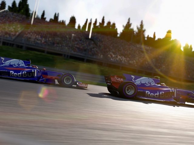 Twee F1 2017 raceauto's op een circuit in de zon.