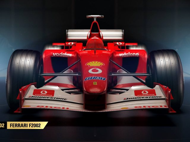 Een rode F1 2017-raceauto in een donkere kamer.