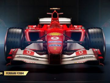 Een rode F1 2017-raceauto in een donkere kamer.