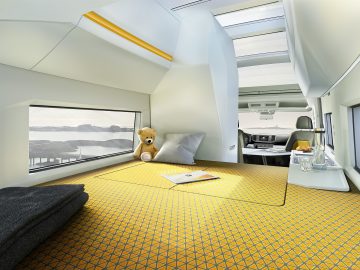 Een kamer in een trein met een teddybeer op bed, ideaal voor de Nederlandse kampeerder.