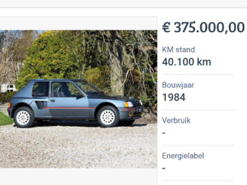 Een klassieke Peugeot 205 T16 uit 1984 wordt buiten op grind tentoongesteld en kost € 375.000. Er staat 40.100 km op de teller zonder gespecificeerde energielabel- of brandstofverbruiksgegevens.