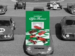 Een groep Alfa Romeo-auto's geparkeerd op een parkeerplaats.