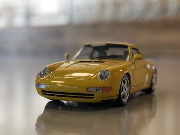 AutoRAI in Miniatuur - Porsche 911 993 van Bburago