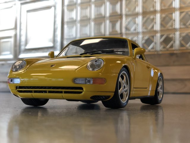 AutoRAI in Miniatuur - Porsche 911 993 van Bburago