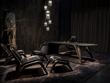 Een eeuwfeestkamer met een zwarte tafel en stoelen.