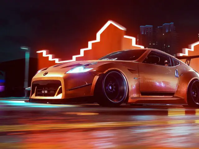 Een auto die 's nachts door een straat rijdt in Need for Speed Heat.