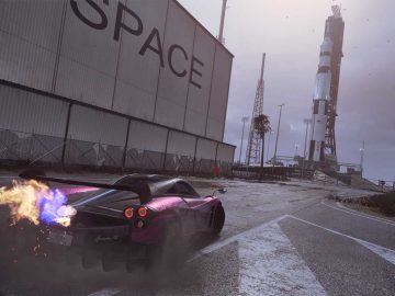 Een auto die door de straat rijdt in "Need for Speed Heat" met een raket op de achtergrond.