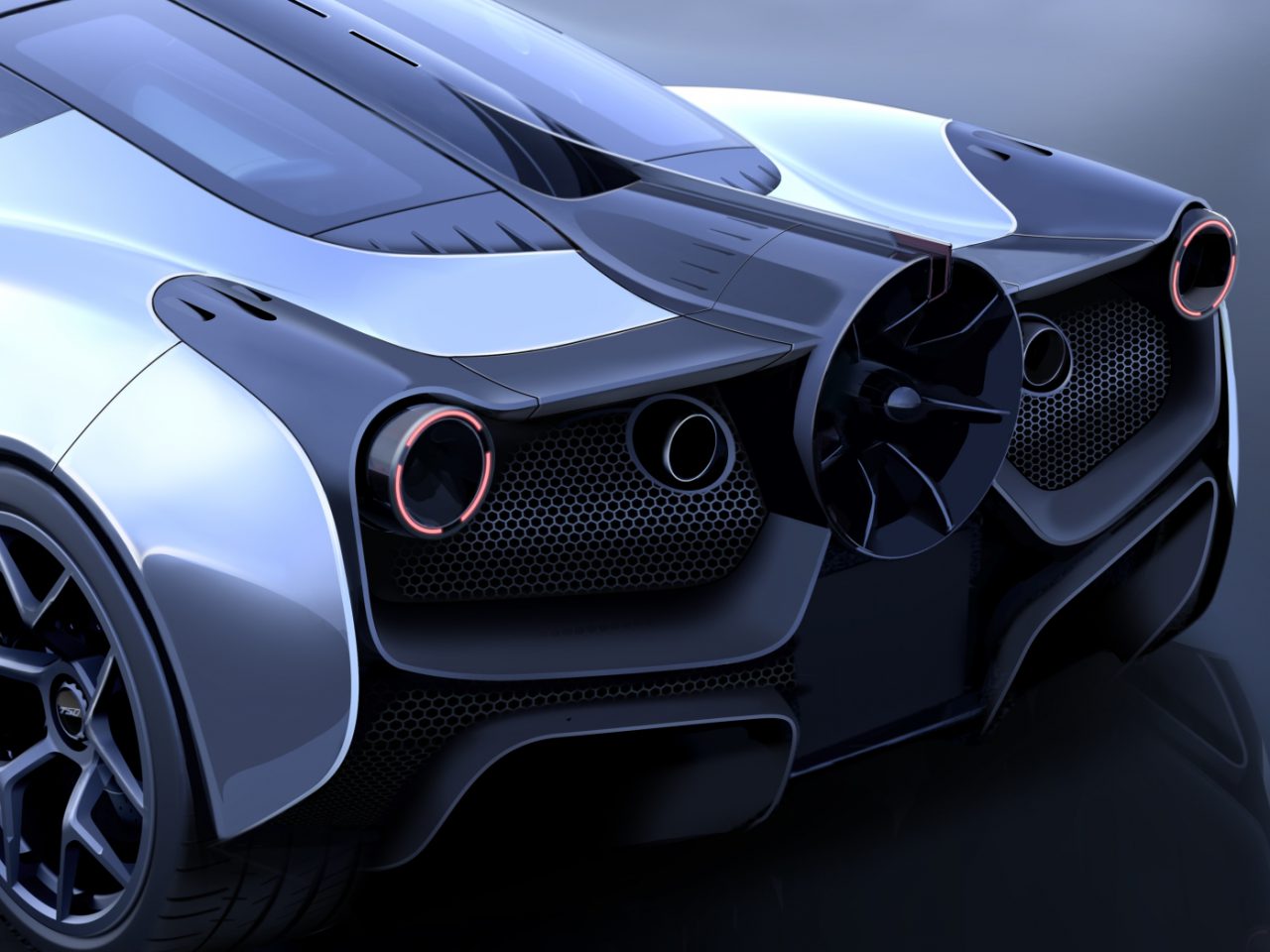 Het achteraanzicht van een futuristische sportwagen van Gordon Murray Automotive T.50.