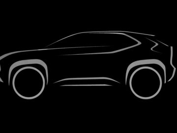 Silhouet van een Toyota-auto op een zwarte achtergrond.