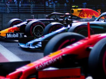 Formule 1-raceauto's in levendige kleuren opgesteld op het circuit, klaar voor de competitie, geïnspireerd op 'Drive to Survive' seizoen 2.