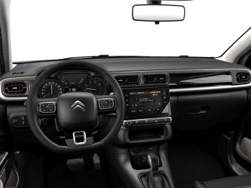 Binnenaanzicht van het moderne dashboard en het stuur van een Citroën C3.