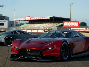 Twee high-performance auto's, waaronder een Mazda RX-Vision GT3 Concept met opvallend aerodynamisch ontwerp, op een racecircuit.