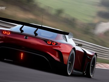 Een Mazda RX-Vision GT3 Concept-sportwagen die racet op een circuit, met het 'gran turismo'-logo zichtbaar.