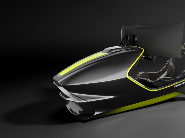 Een strakke, moderne Aston Martin-racesimulatoropstelling met een zwart-geel ontwerp, een realistisch stuur en een groot beeldscherm.
