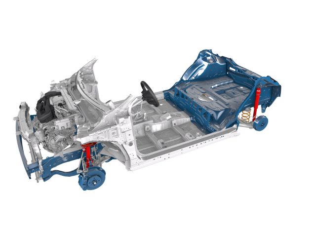 Een transparant beeld van een gedeeltelijk gemonteerd Toyota Aygo-chassis toont de voor- en achtervering, de motor, het stuur en de framestructuur tegen een witte achtergrond.