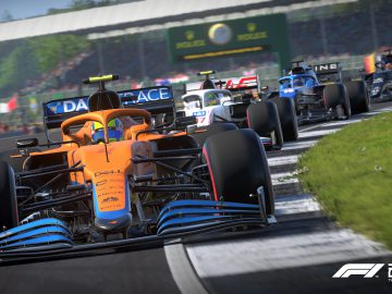 In de videogame F1 2021 zijn verschillende Formule 1-raceauto's te zien die strijden op een circuit, met een feloranje auto voorop. Op de achtergrond zijn stands en sponsorborden te zien, die perfect de opwindende spanning van een authentiek Grand Prix-evenement weergeven.
