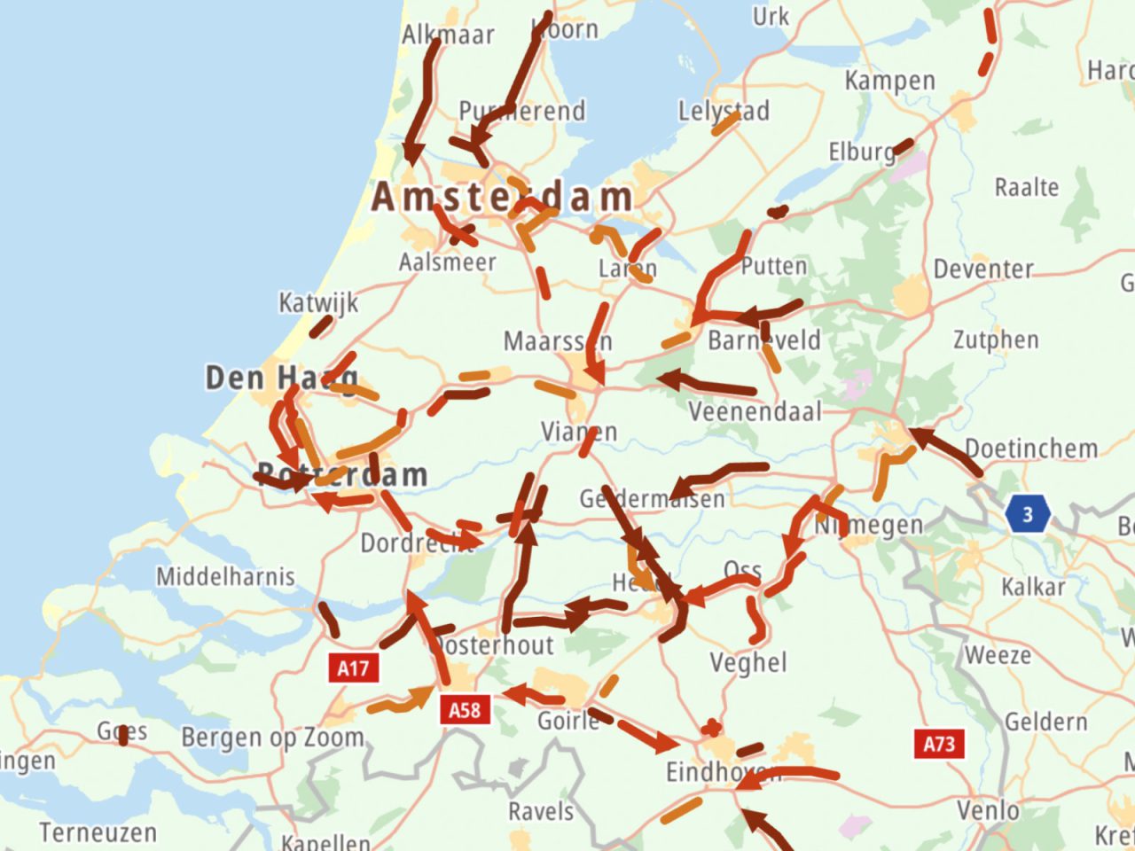 Een kaart van Nederland waarop de belangrijkste wegen met rode en bruine lijnen zijn gemarkeerd, die verkeersopstoppingen rond steden als Amsterdam, Rotterdam en Utrecht aangeven. Dit gedetailleerde overzicht van "bestanden" in Nederland geeft een duidelijk momentopname van de drukste routes.