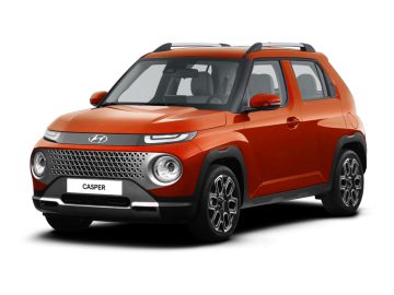 Een compacte, oranje Hyundai Casper SUV met strakke dakrails, een ingewikkelde grille en opvallende ronde koplampen, vanaf de voorkant gezien vanuit een kleine hoek.