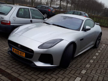 A silver Jaguar F-Type SVR sports car parked in a parking lot, Spotted.