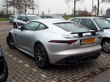 Spotted: a silver Jaguar F-Type SVR sports car parked in a parking lot.