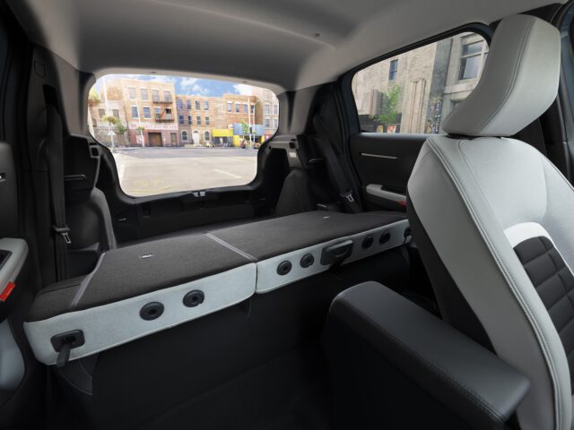 Interior view of a Citroën C3 with the rear seats folded down, increasing cargo space.