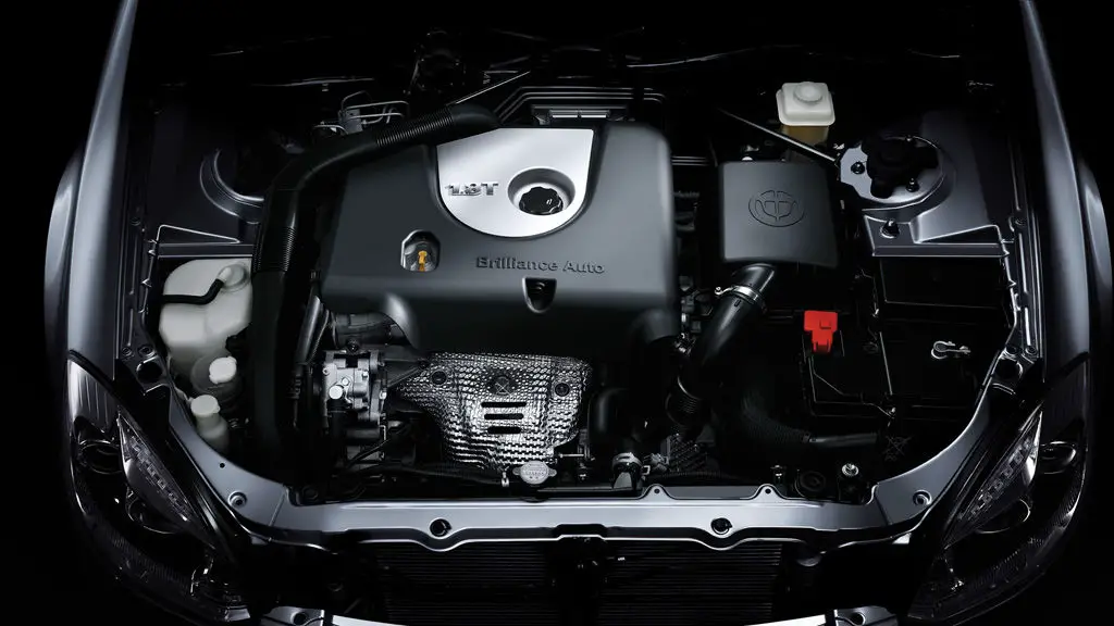 Top view of a Brilliance BS4 auto engine showing various components, including hoses, a coolant reservoir and a battery. In this Spotted image, the Brilliance Auto brand is visible on the hood.