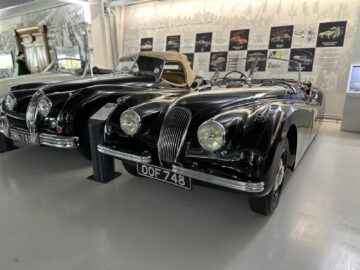 A black vintage convertible with license plate 