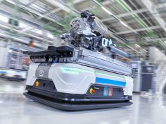 In the picture: driverless transport vehicle with a finished electric motor ...